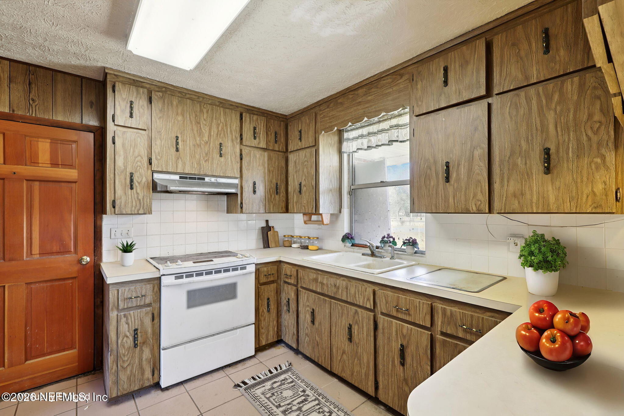54031 Sheffield Road Callahan, FL 32011 - Photo 14 of 56 a kitchen with a sink cabinets and appliances