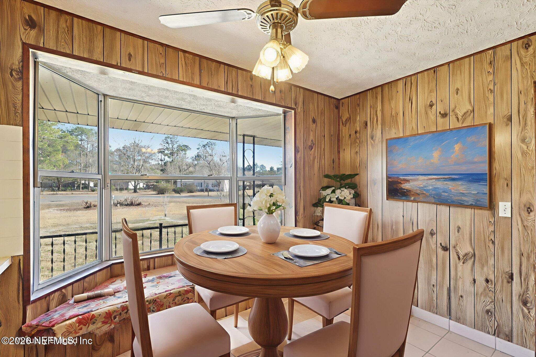 54031 Sheffield Road Callahan, FL 32011 - Photo 16 of 59 a view of a dining room with furniture window and outside view