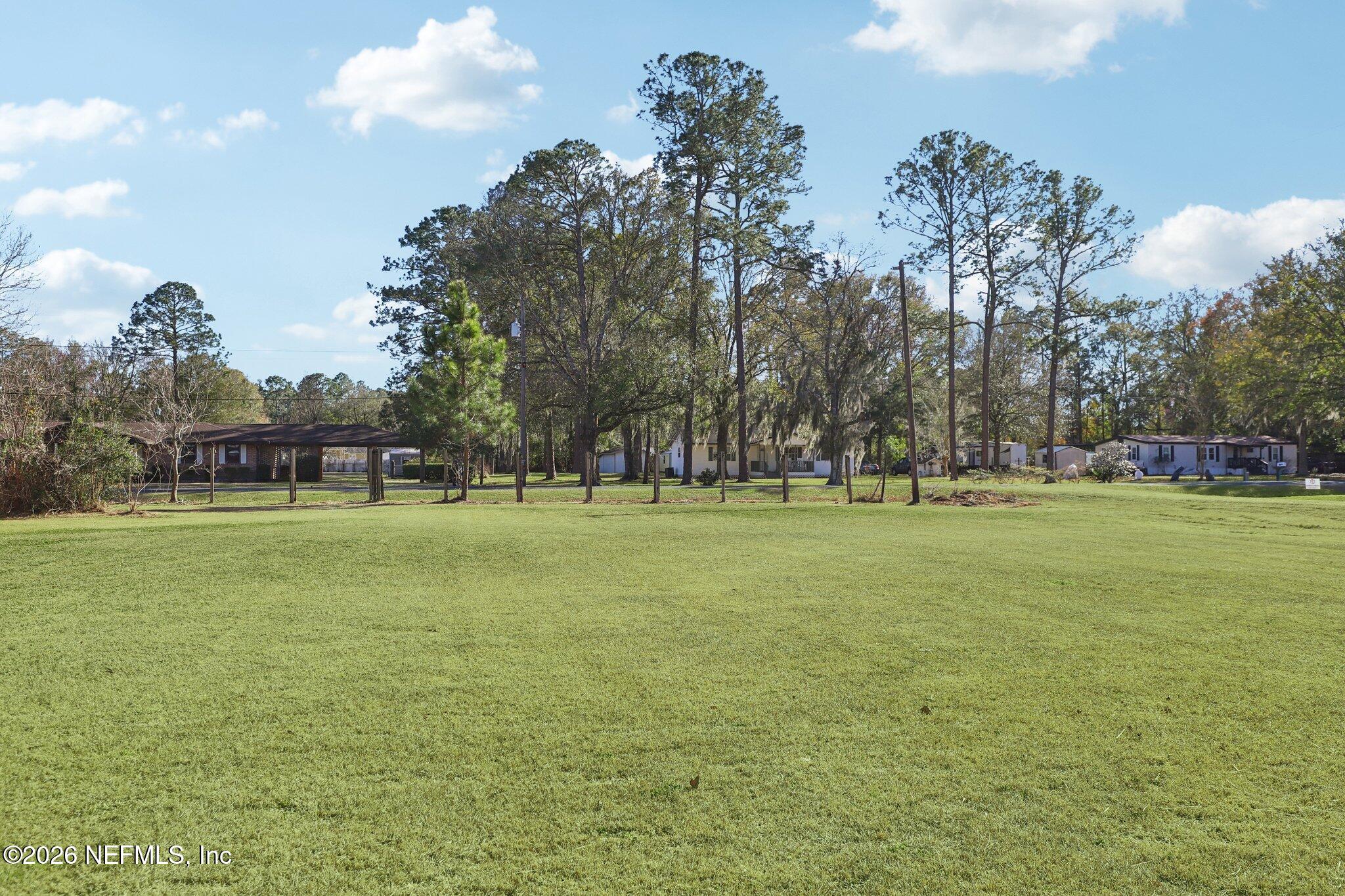 54031 Sheffield Road Callahan, FL 32011 - Photo 39 of 56 a huge green field with lots of trees