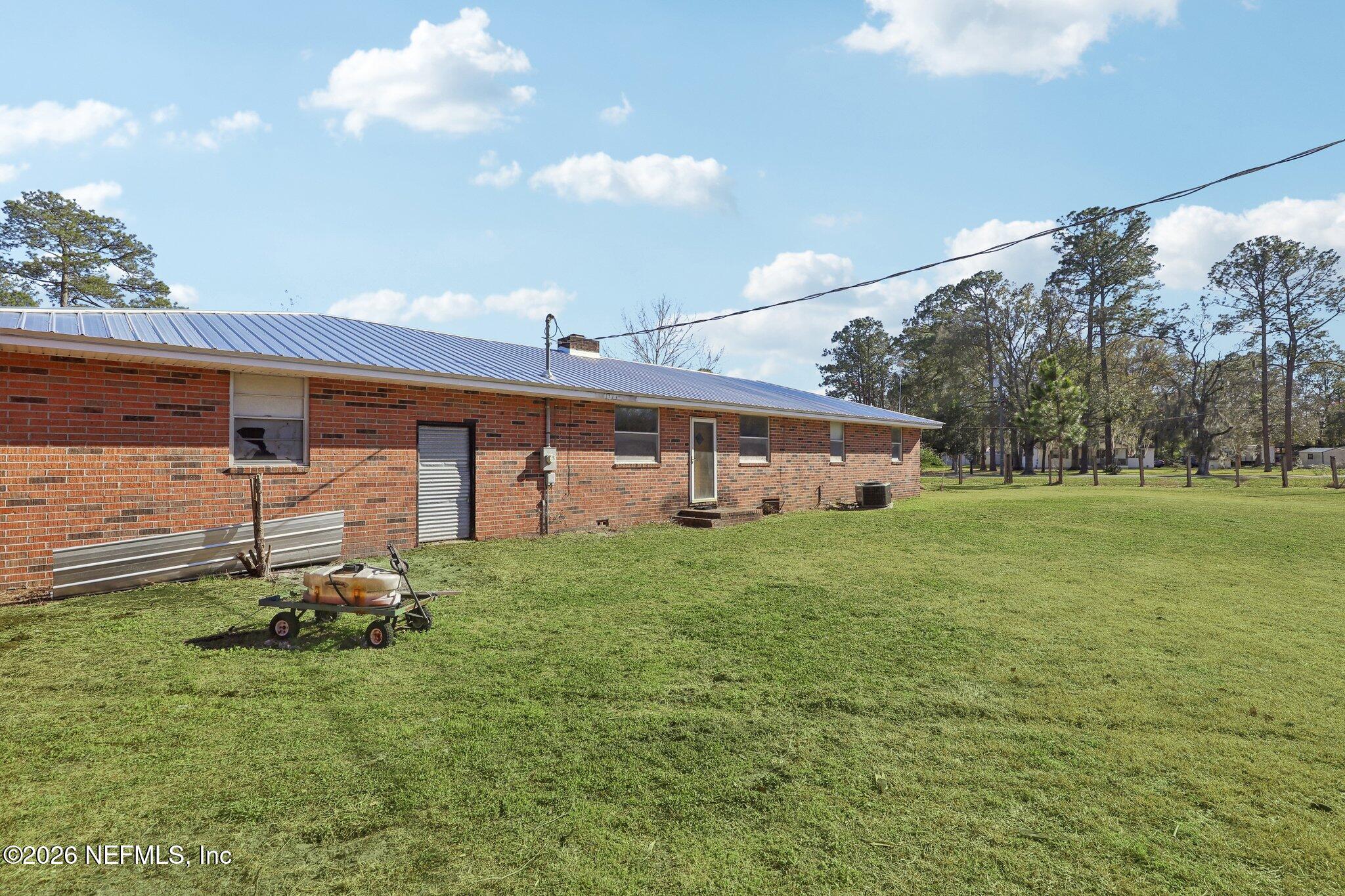 54031 Sheffield Road Callahan, FL 32011 - Photo 40 of 59 a house view with a garden space
