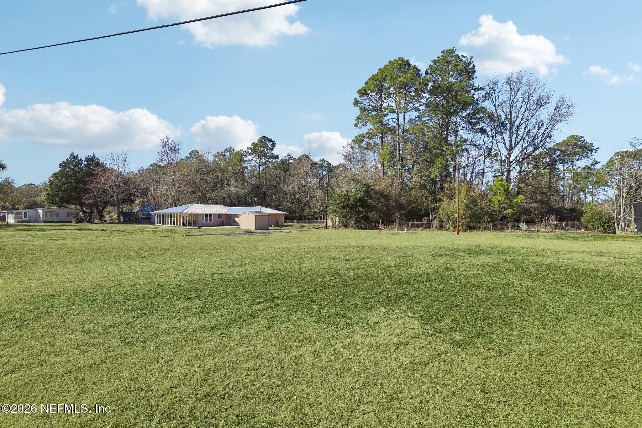 54031 Sheffield Road Callahan, FL 32011 - Photo 46 of 59 a view of outdoor space with green field