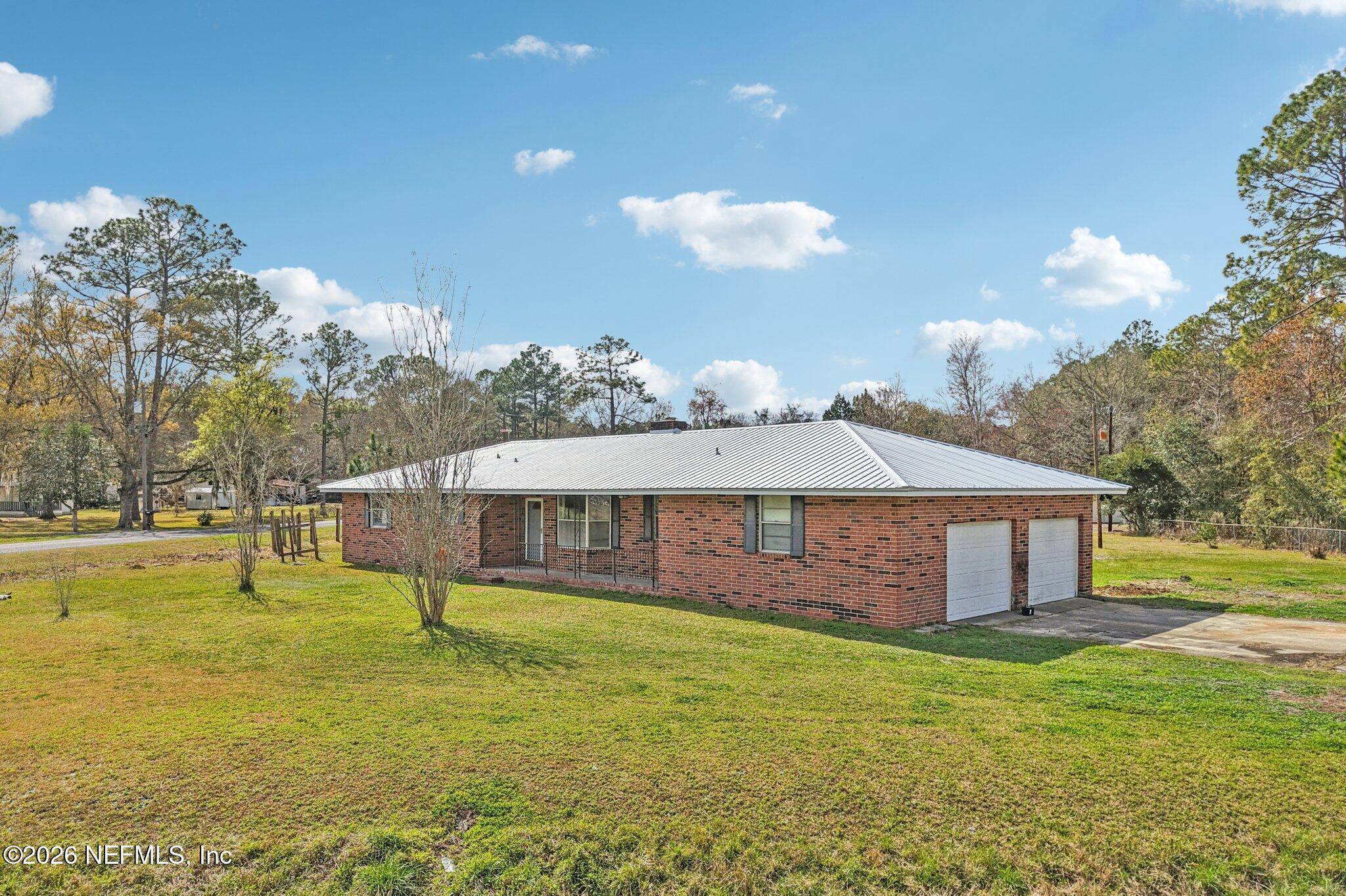 54031 Sheffield Road Callahan, FL 32011 - Photo 54 of 56 a view of a house with a yard