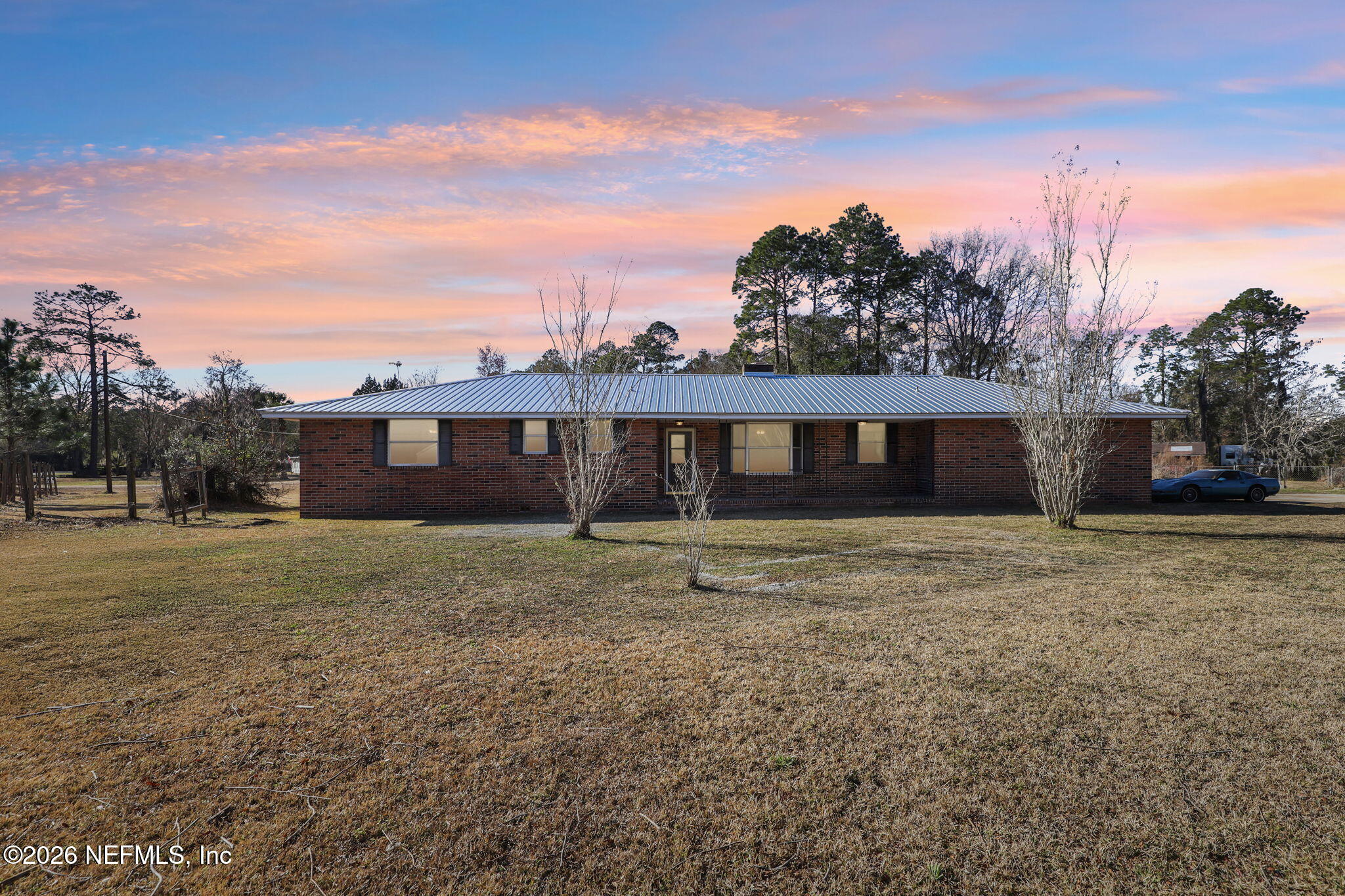 54031 Sheffield Road Callahan, FL 32011 - Photo 6 of 59 a front view of a house with a yard