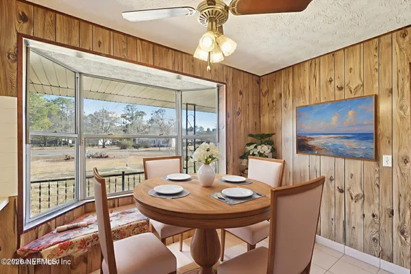 a view of a dining room with furniture window and outside view