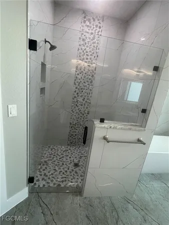 a bathroom with a shower and toilet