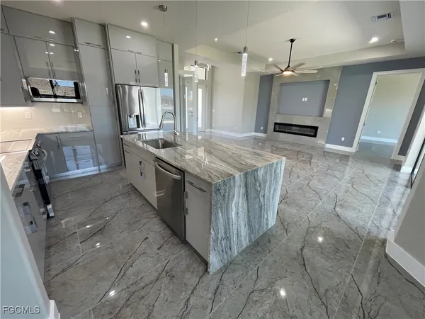 a large bathroom with a large tub and sink