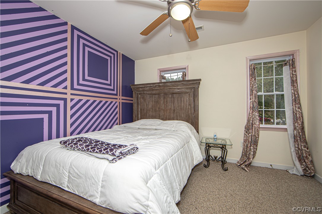 4230 Gayle Road Chester, VA 23831 - Photo 19 of 28 a bedroom with a bed and a window