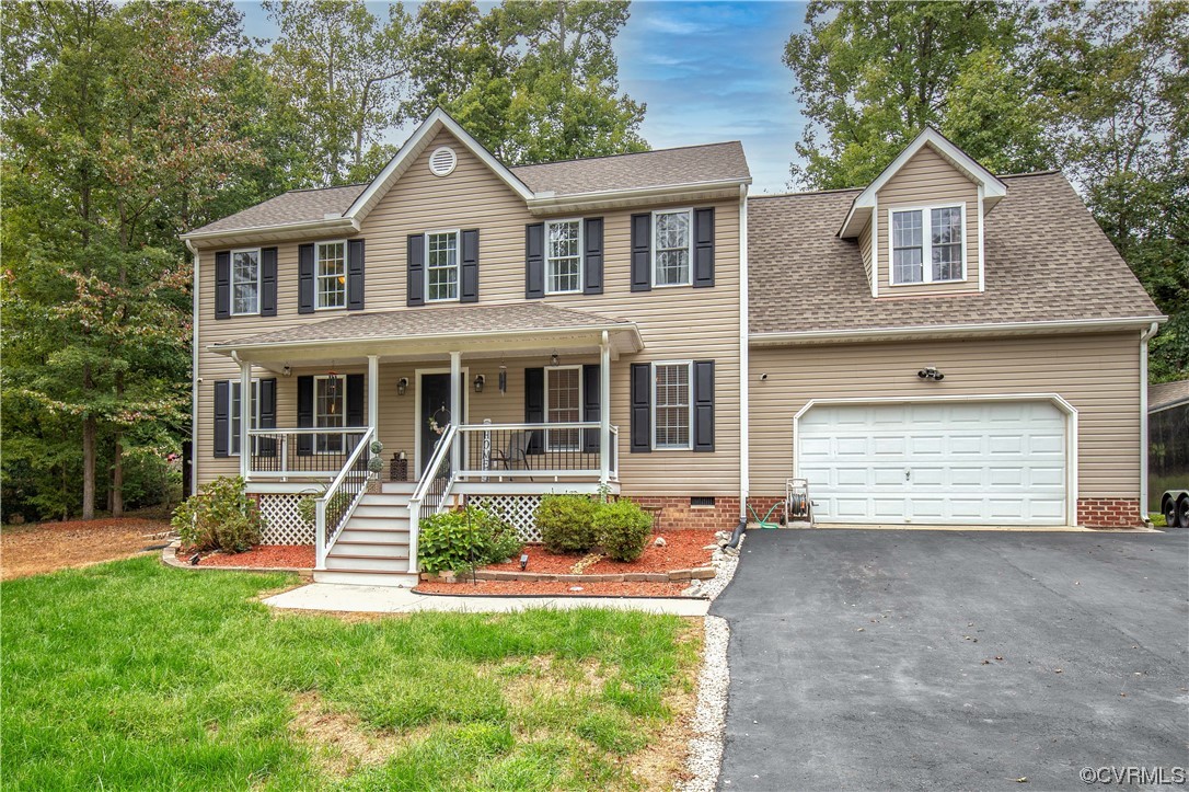 4230 Gayle Road Chester, VA 23831 - Photo 2 of 28 a front view of a house with a yard and garage