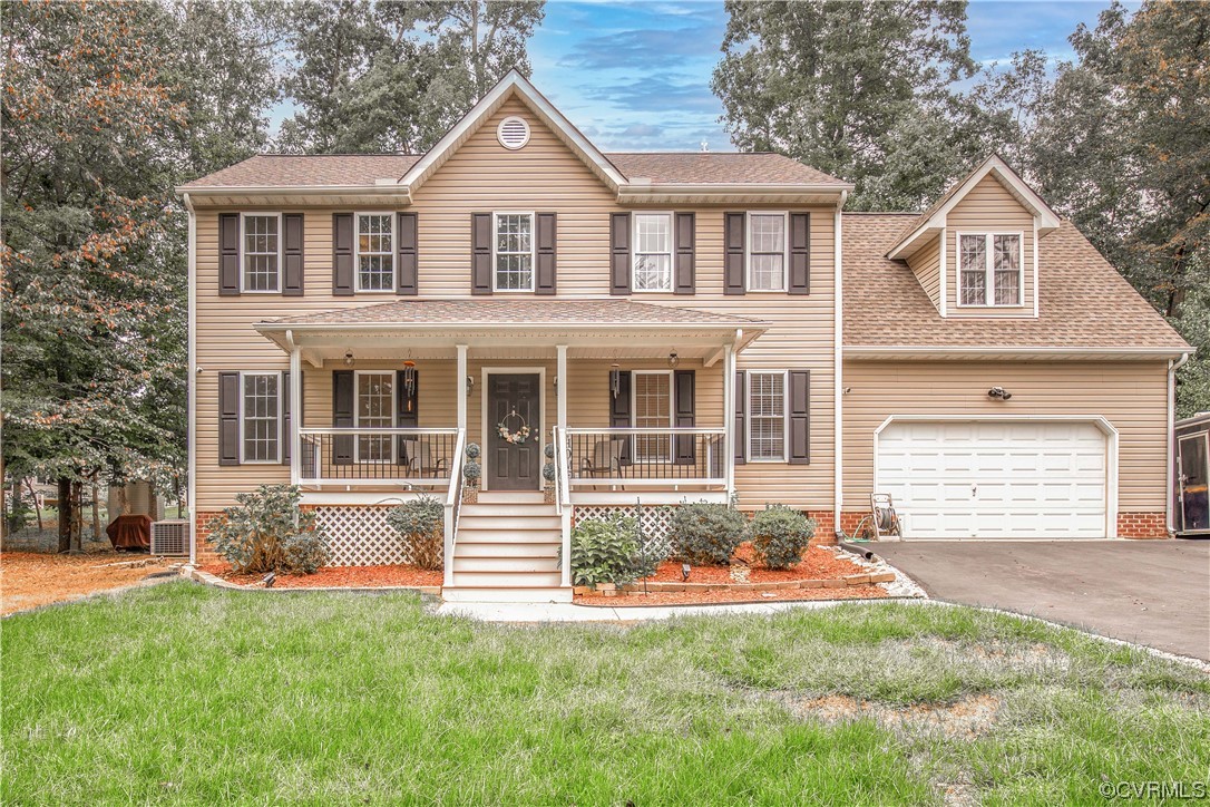 4230 Gayle Road Chester, VA 23831 - Photo 3 of 28 a front view of a house with a yard