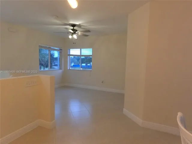 a view of a kitchen with a sink