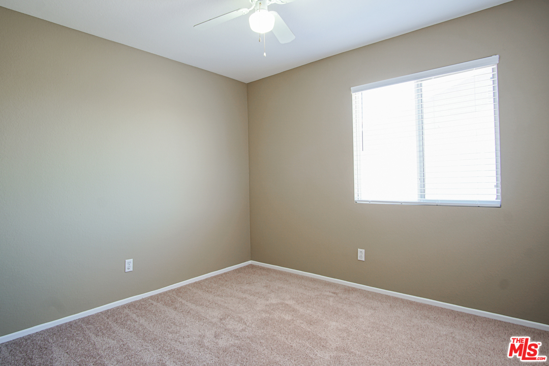 14721 Carter Road Victorville, CA 92394 - Photo 22 of 37 an empty room with a window