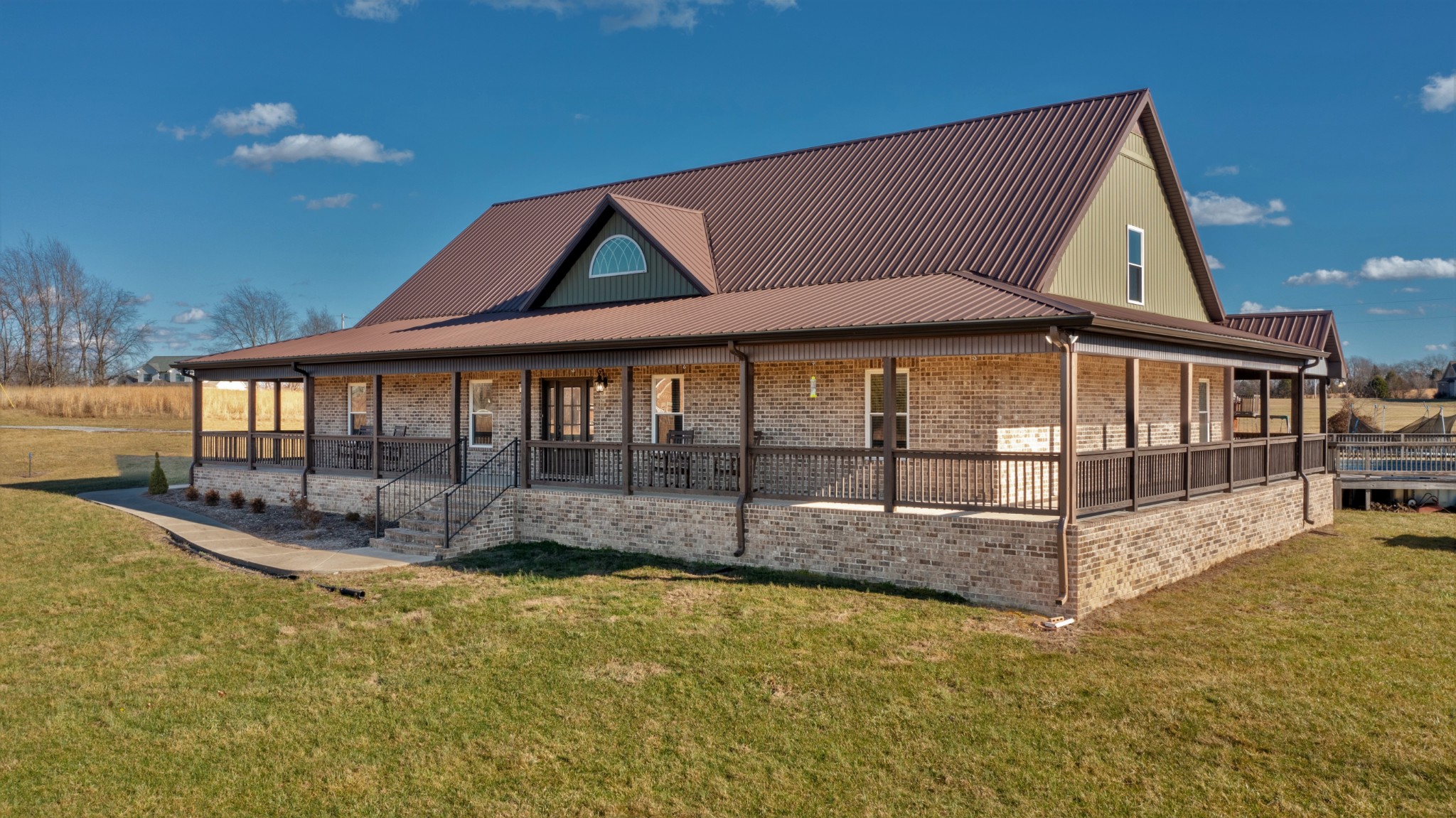 157 Roark Road Cottontown, TN 37048 - Photo 3 of 32 a view of swimming pool with seating area