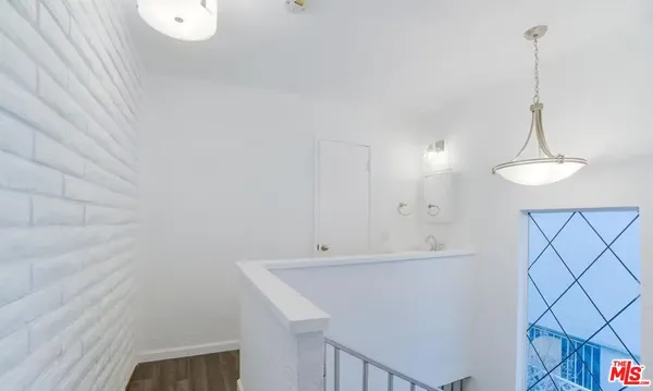 a bathroom with a shower and a sink
