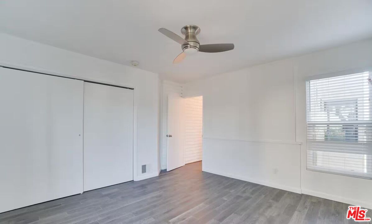 16 Reef Street Marina del Rey, CA 90292 - Photo 17 of 21 a view of an empty room with wooden floor and a window