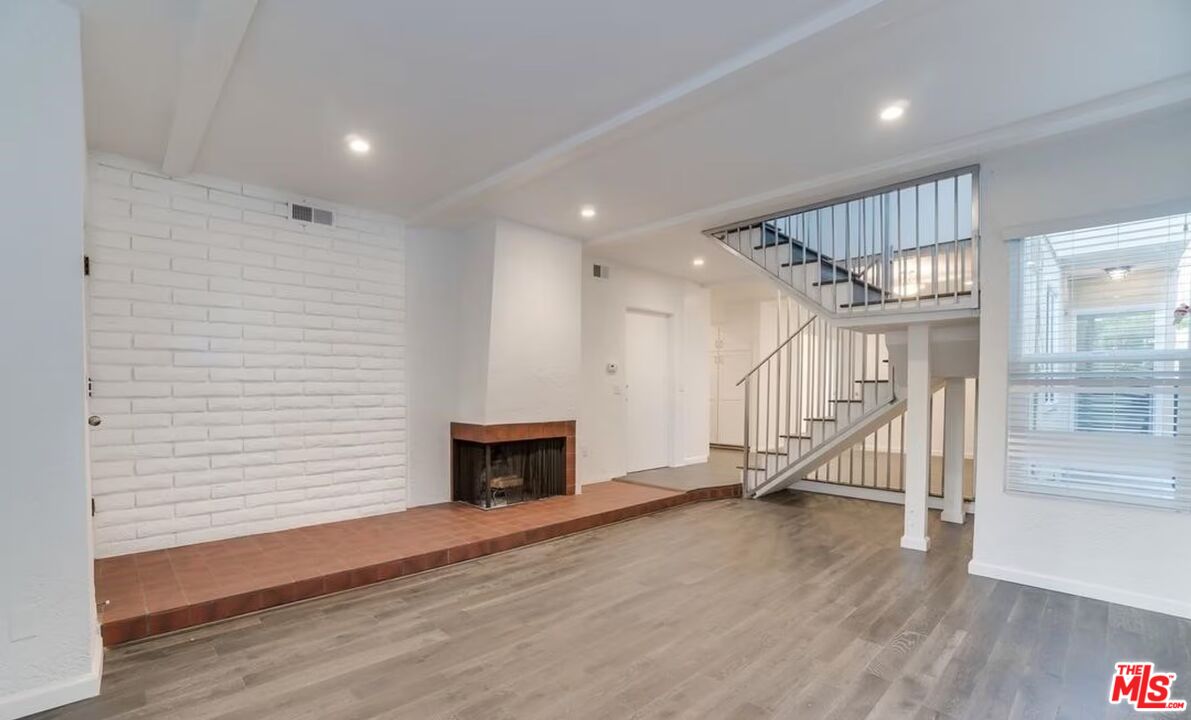 16 Reef Street Marina del Rey, CA 90292 - Photo 20 of 21 a view of an empty room with wooden floor fireplace and a window