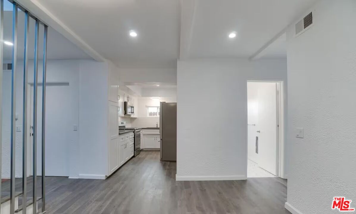 16 Reef Street Marina del Rey, CA 90292 - Photo 7 of 21 a view of a kitchen with a refrigerator and wooden floor