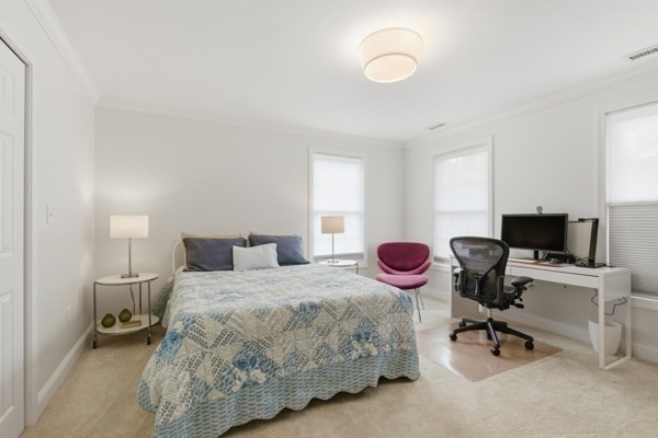 3 Wing Road Wilmington, MA 01887 - Photo 24 of 36 a bedroom with a bed and a chair