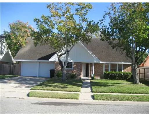 front view of a house and a tree