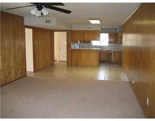 a view of a kitchen with a sink and cabinet area