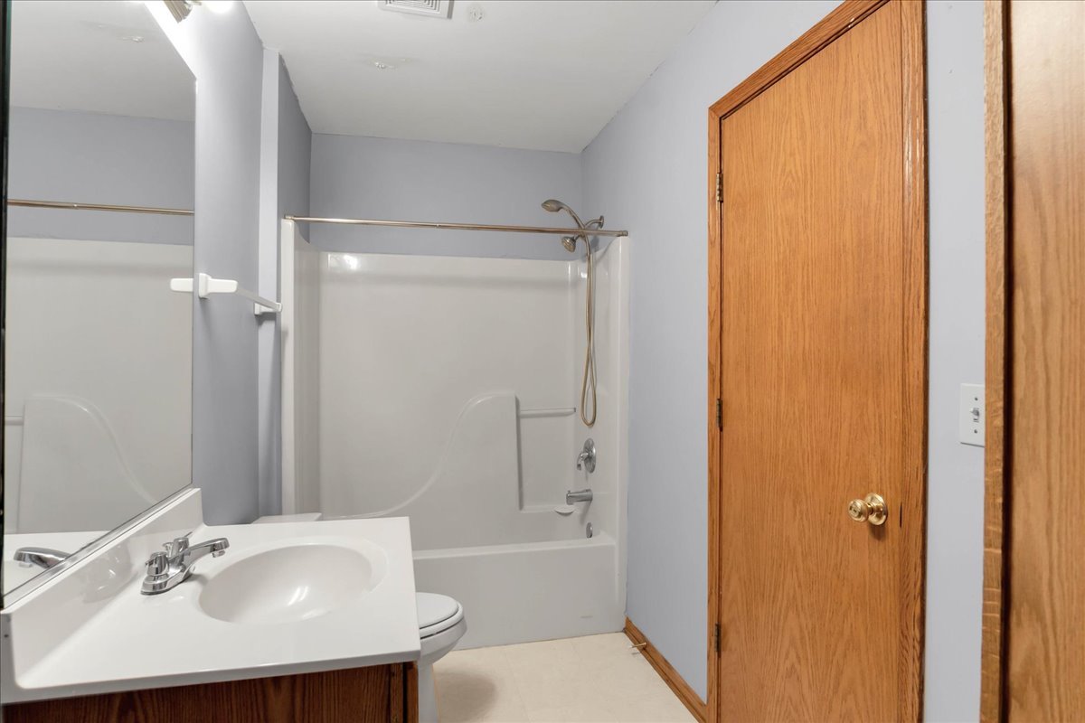 2029 Ridgemoor Drive Plainfield, IL 60586 - Photo 20 of 30 a bathroom with a sink and a mirror