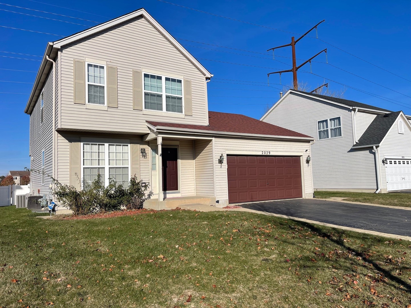 2029 Ridgemoor Drive Plainfield, IL 60586 - Photo 2 of 30 a front view of a house with garden