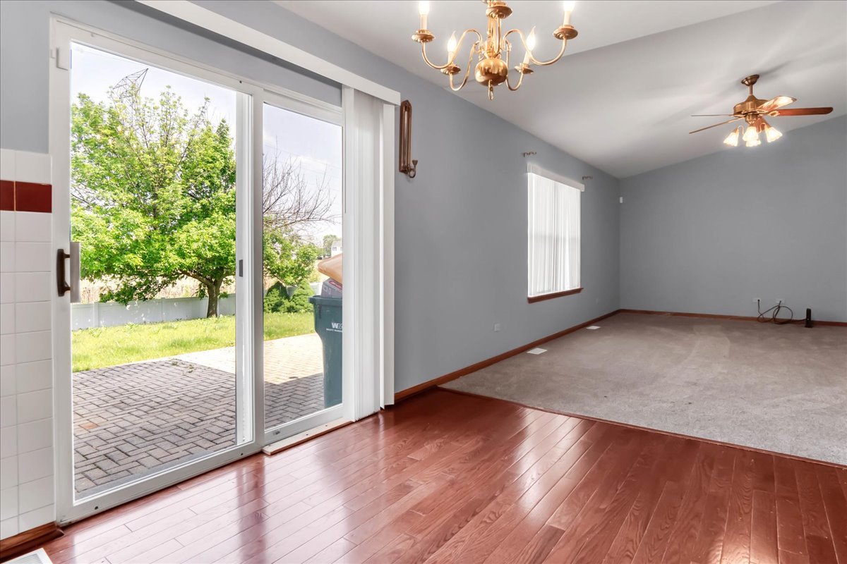 2029 Ridgemoor Drive Plainfield, IL 60586 - Photo 10 of 30 a view of empty room with wooden floor and fan