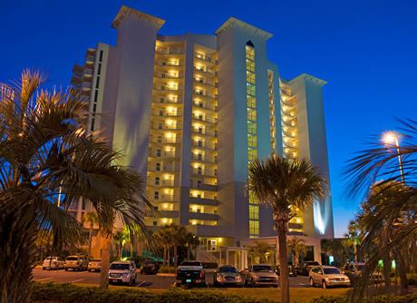 970 Highway 98, Unit 305 Destin, FL 32541 - Photo 1 of 65 a city street lined with buildings and trees