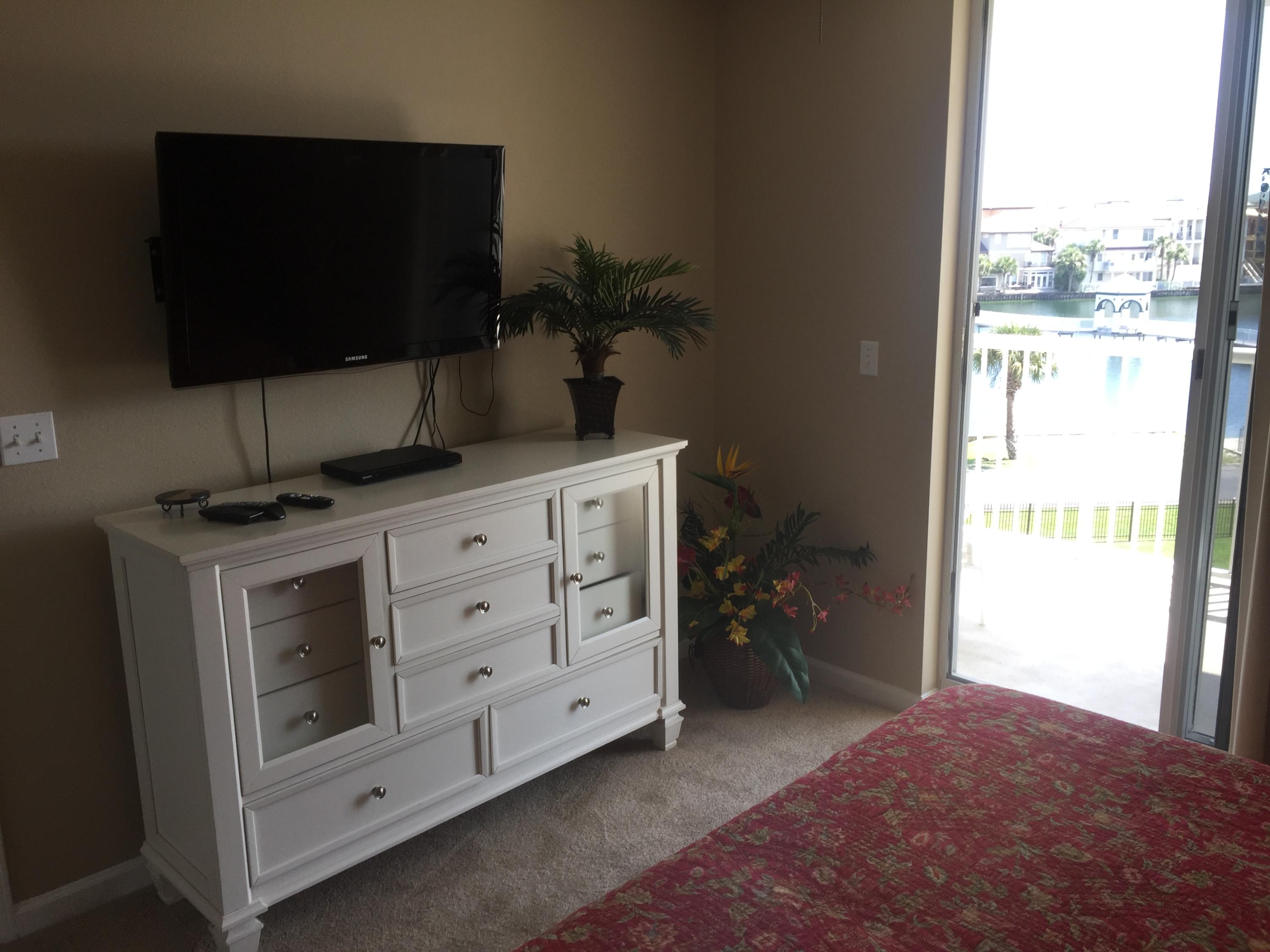 970 Highway 98, Unit 305 Destin, FL 32541 - Photo 15 of 65 a kitchen with a sink and a microwave