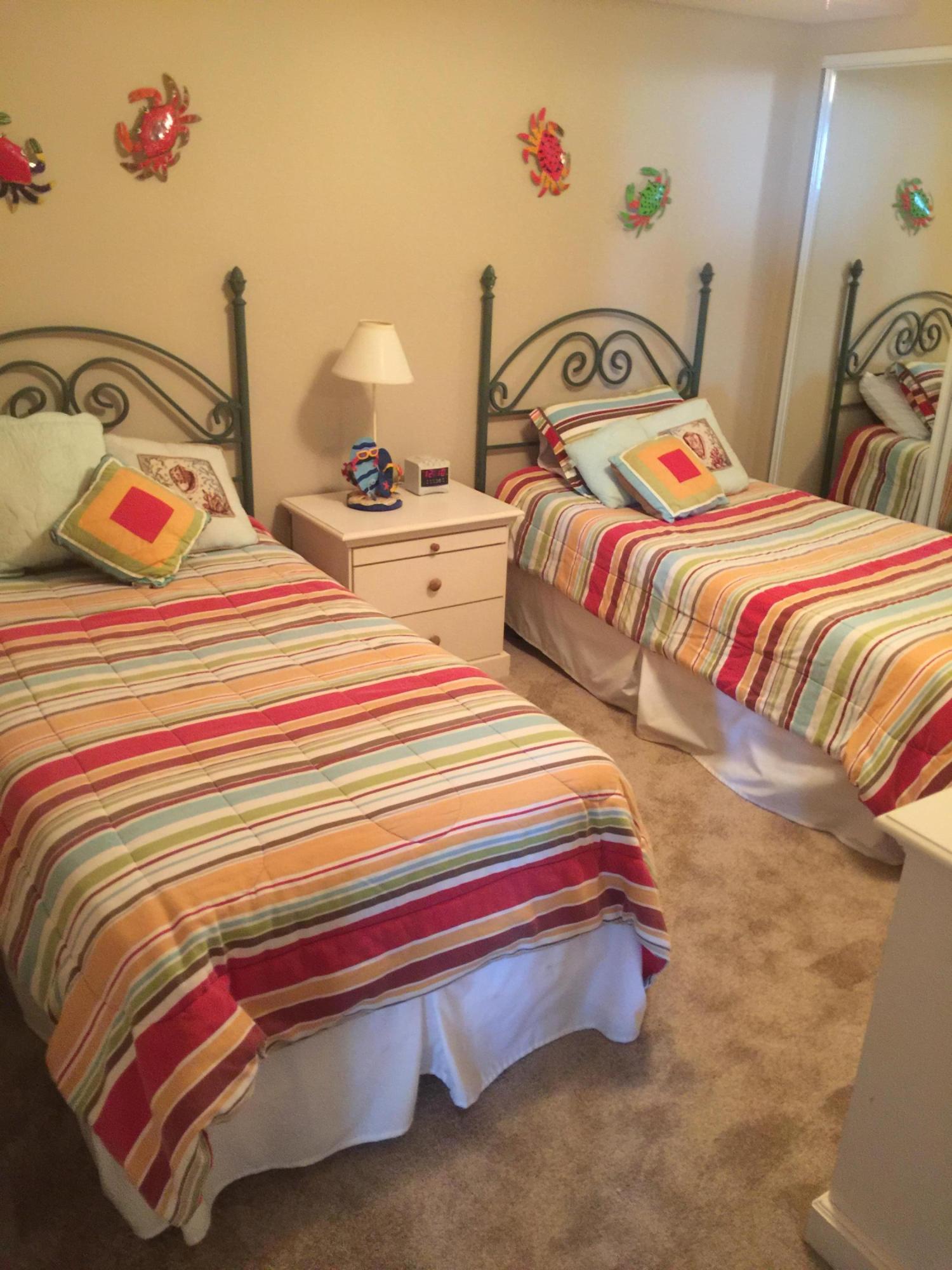 970 Highway 98, Unit 305 Destin, FL 32541 - Photo 24 of 65 a bedroom with a bed and dresser