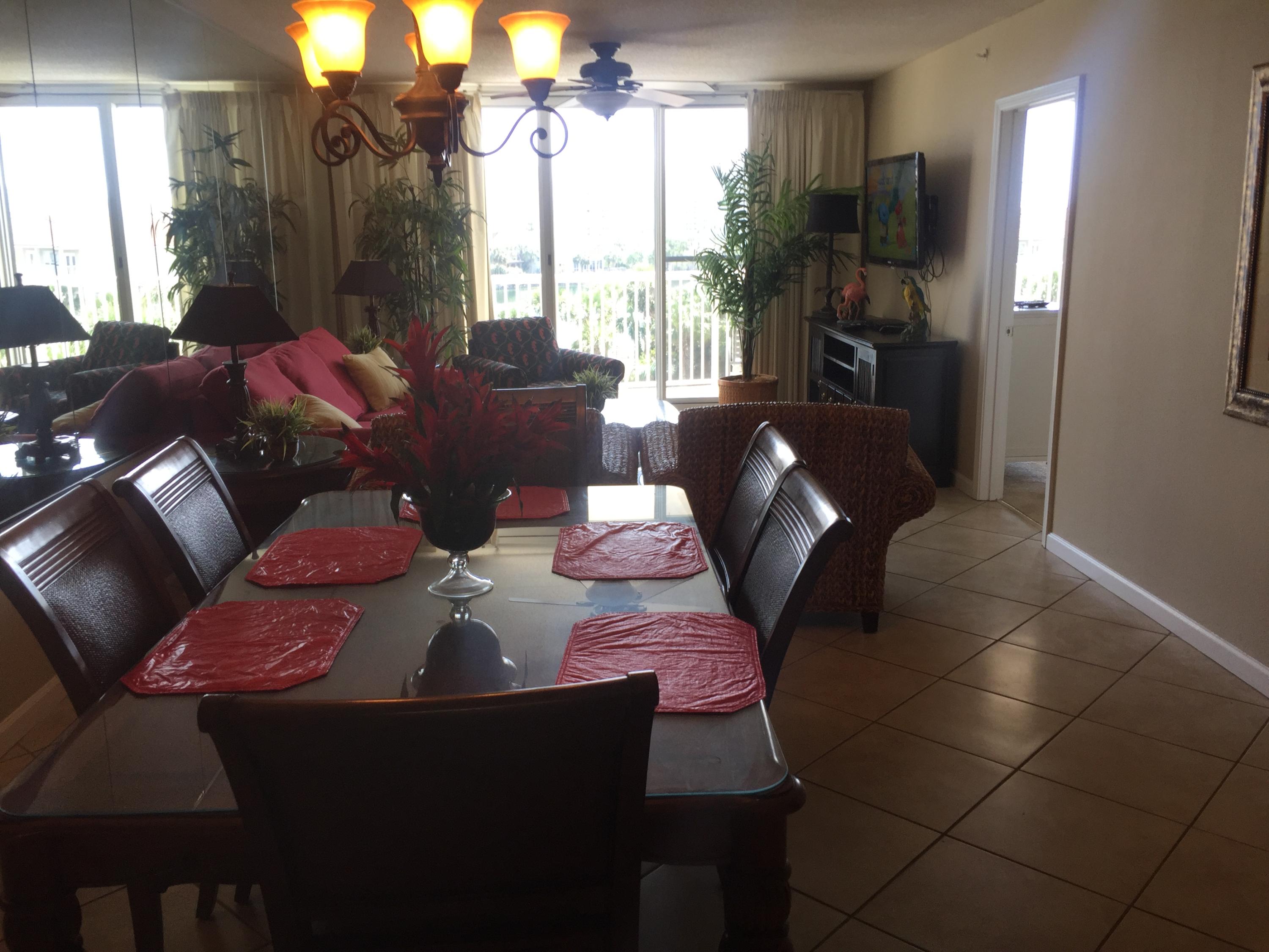 970 Highway 98, Unit 305 Destin, FL 32541 - Photo 28 of 65 a living room with furniture fireplace and large windows