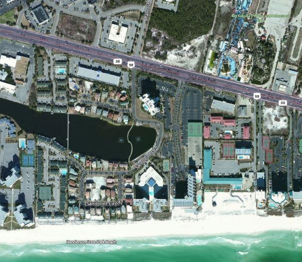 970 Highway 98, Unit 305 Destin, FL 32541 - Photo 43 of 65 a view of parked car and front view of a house