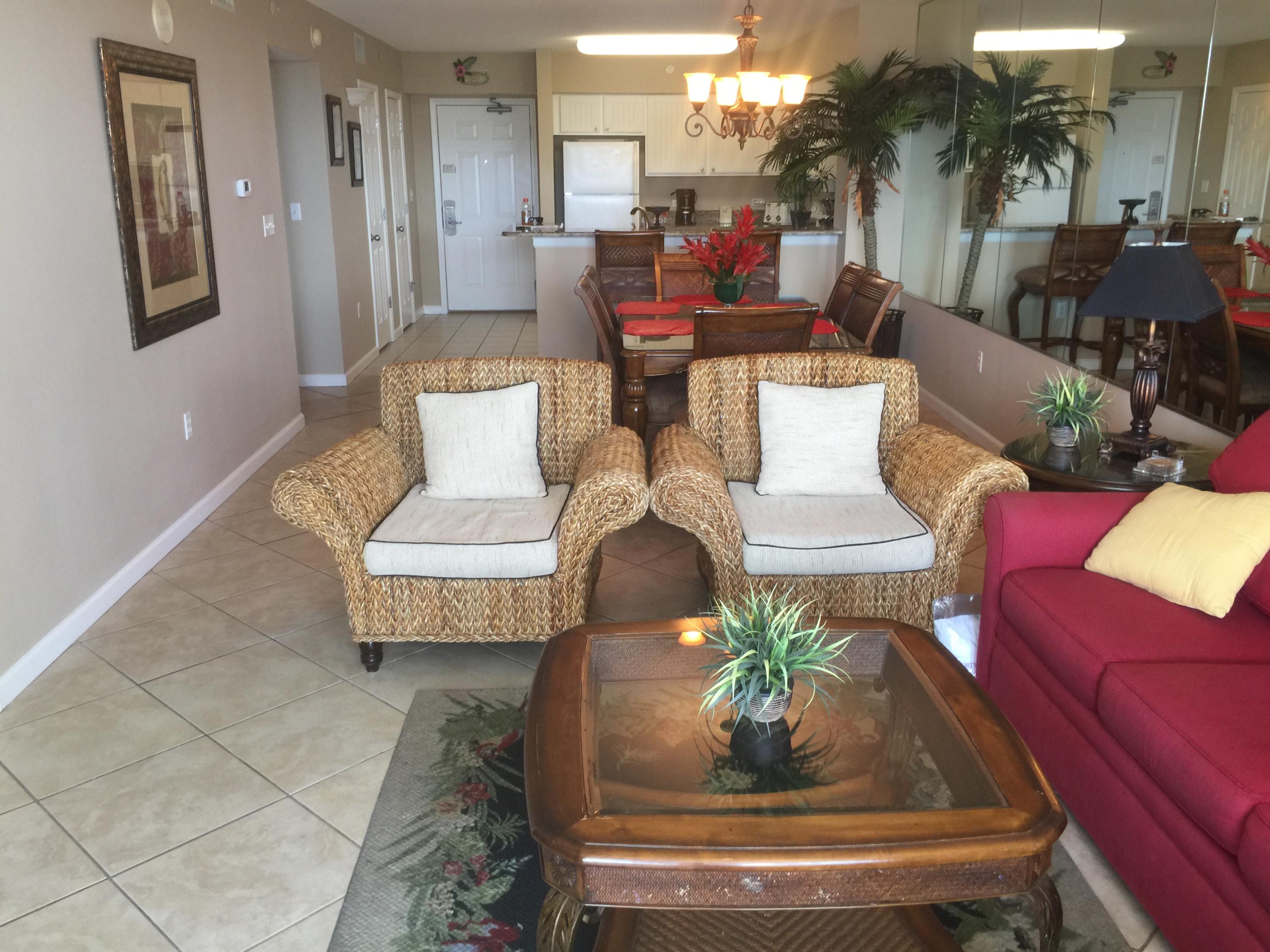 970 Highway 98, Unit 305 Destin, FL 32541 - Photo 5 of 65 a living room with furniture and a chandelier