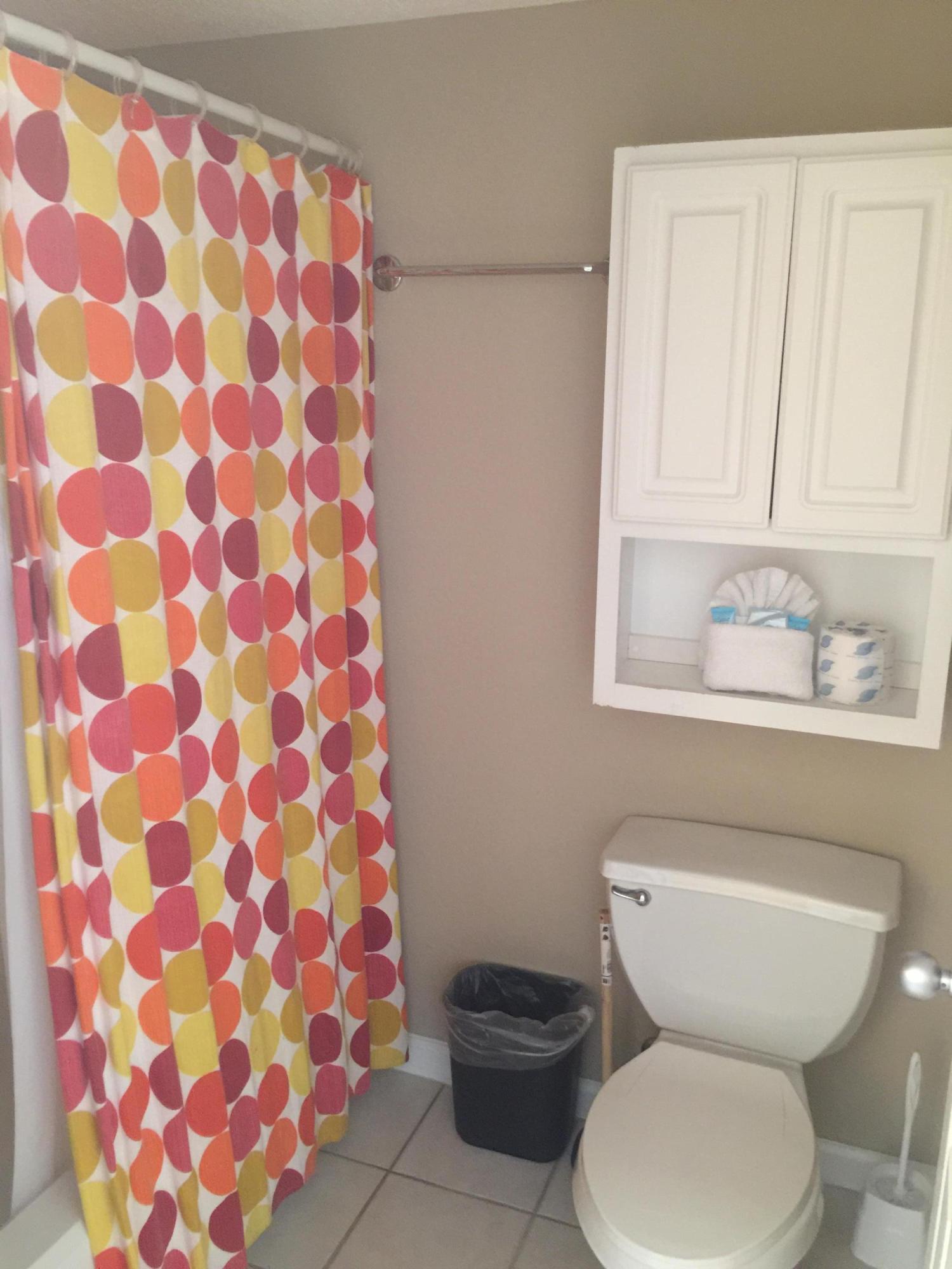 970 Highway 98, Unit 305 Destin, FL 32541 - Photo 61 of 65 a bathroom with a toilet and a sink