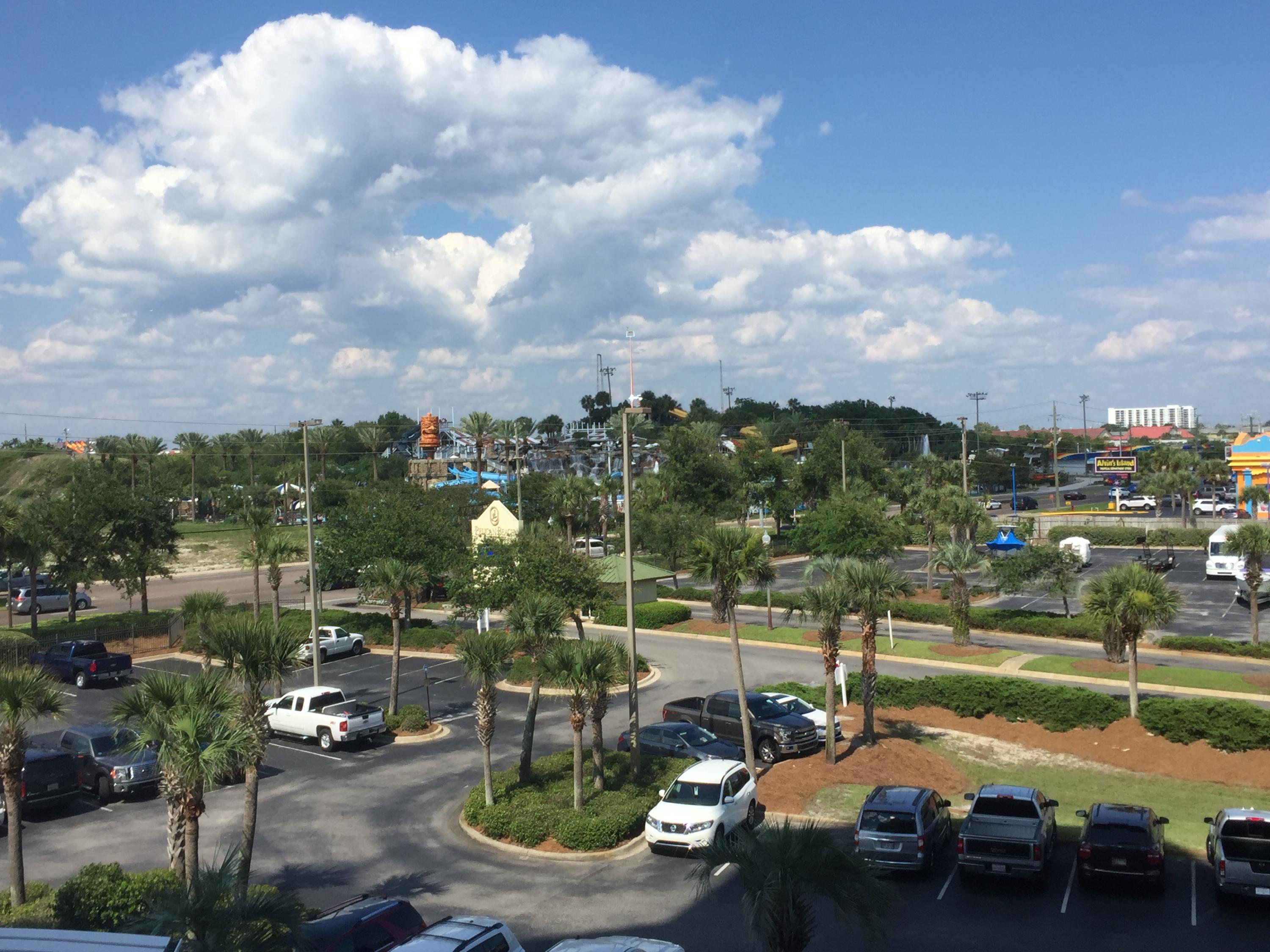 970 Highway 98, Unit 305 Destin, FL 32541 - Photo 63 of 65 a roof deck with table and chairs and potted plants