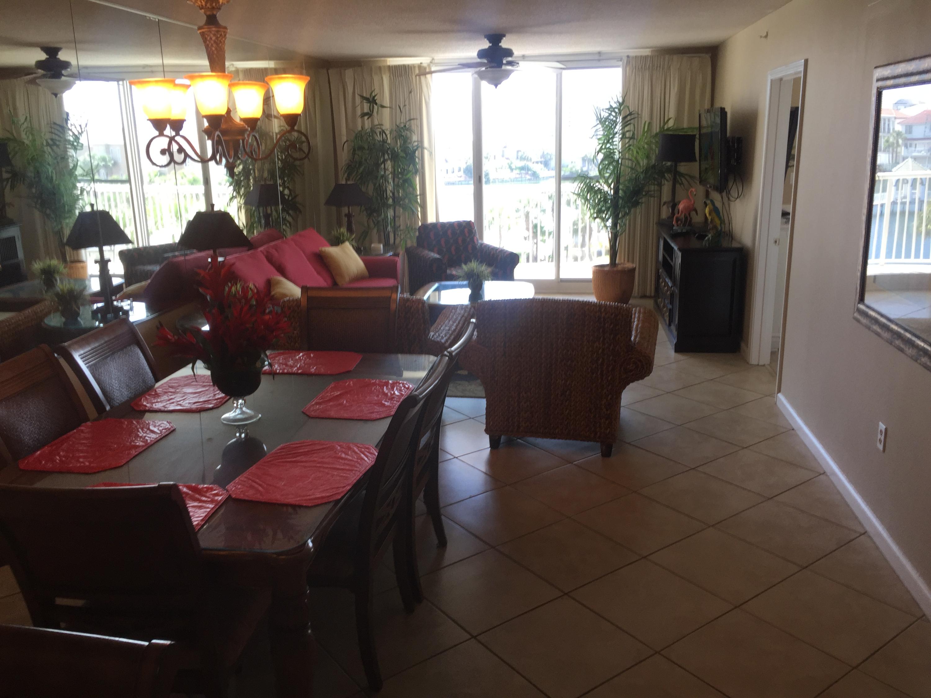 970 Highway 98, Unit 305 Destin, FL 32541 - Photo 8 of 65 a living room with furniture and a floor to ceiling window