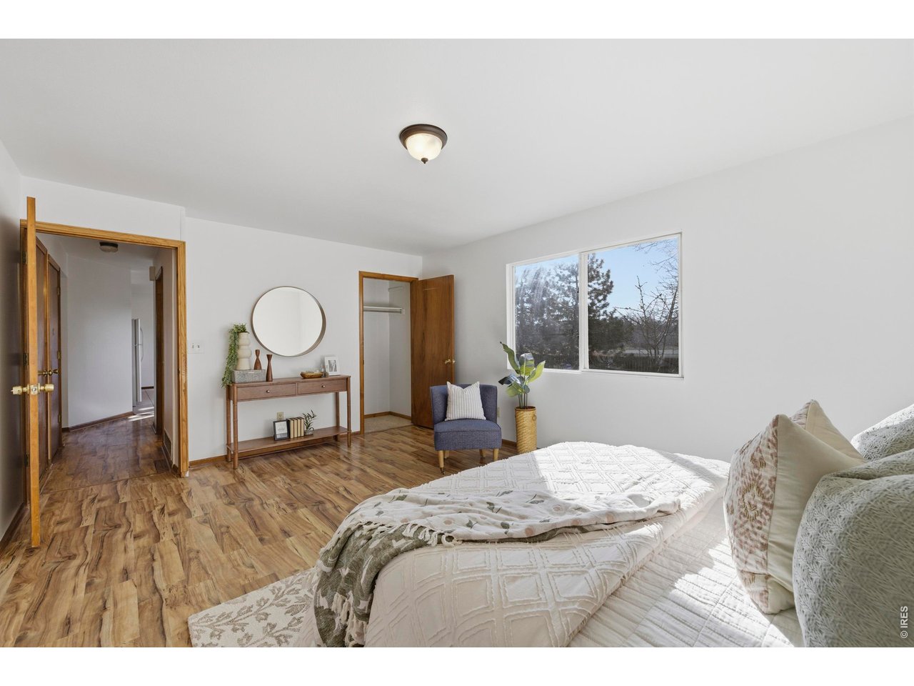 2943 Pleasant Valley Road Fort Collins, CO 80521 - Photo 17 of 38 a bedroom with a bed and wooden floor