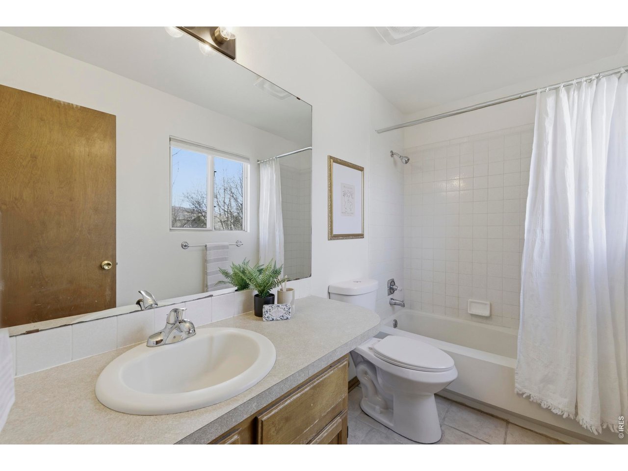 2943 Pleasant Valley Road Fort Collins, CO 80521 - Photo 23 of 38 a bathroom with a sink a toilet and shower
