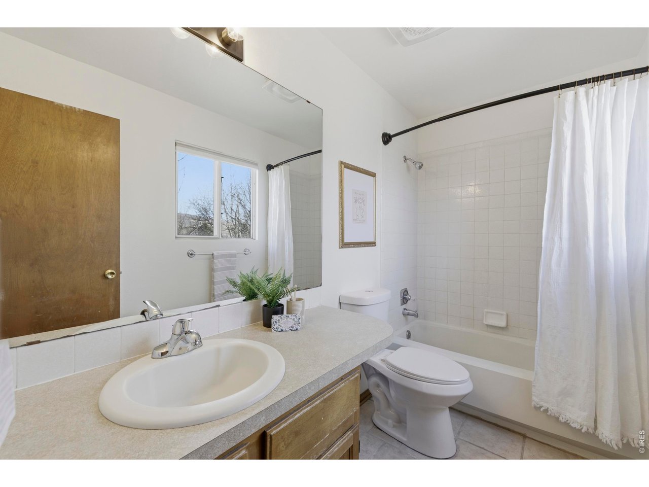2943 Pleasant Valley Road Fort Collins, CO 80521 - Photo 24 of 38 a bathroom with a sink a toilet and shower