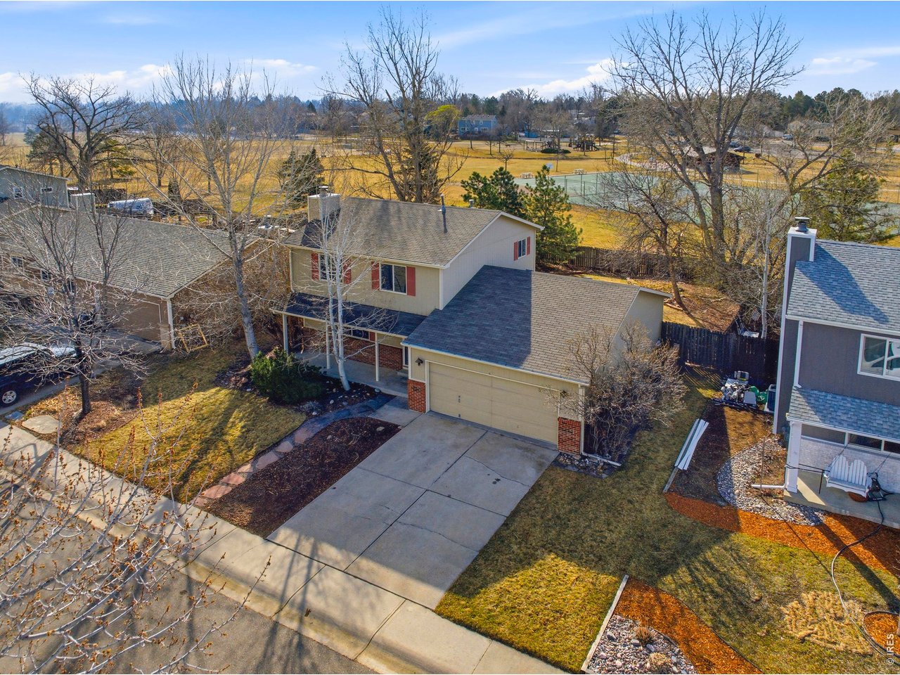2943 Pleasant Valley Road Fort Collins, CO 80521 - Photo 3 of 38 a view of a house with a yard and lake view