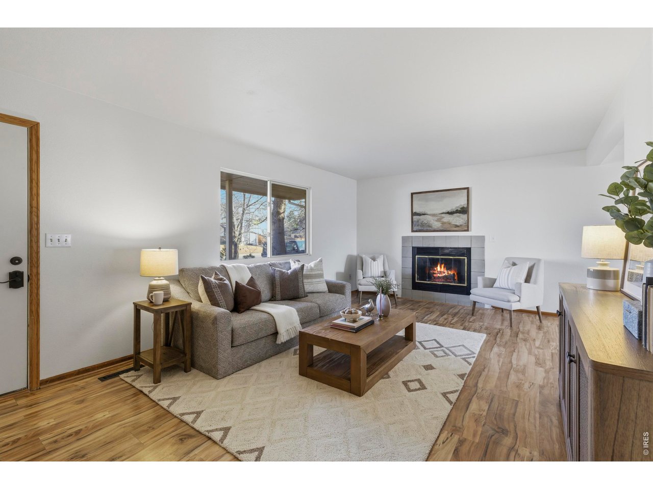 2943 Pleasant Valley Road Fort Collins, CO 80521 - Photo 4 of 38 a living room with furniture and a fireplace