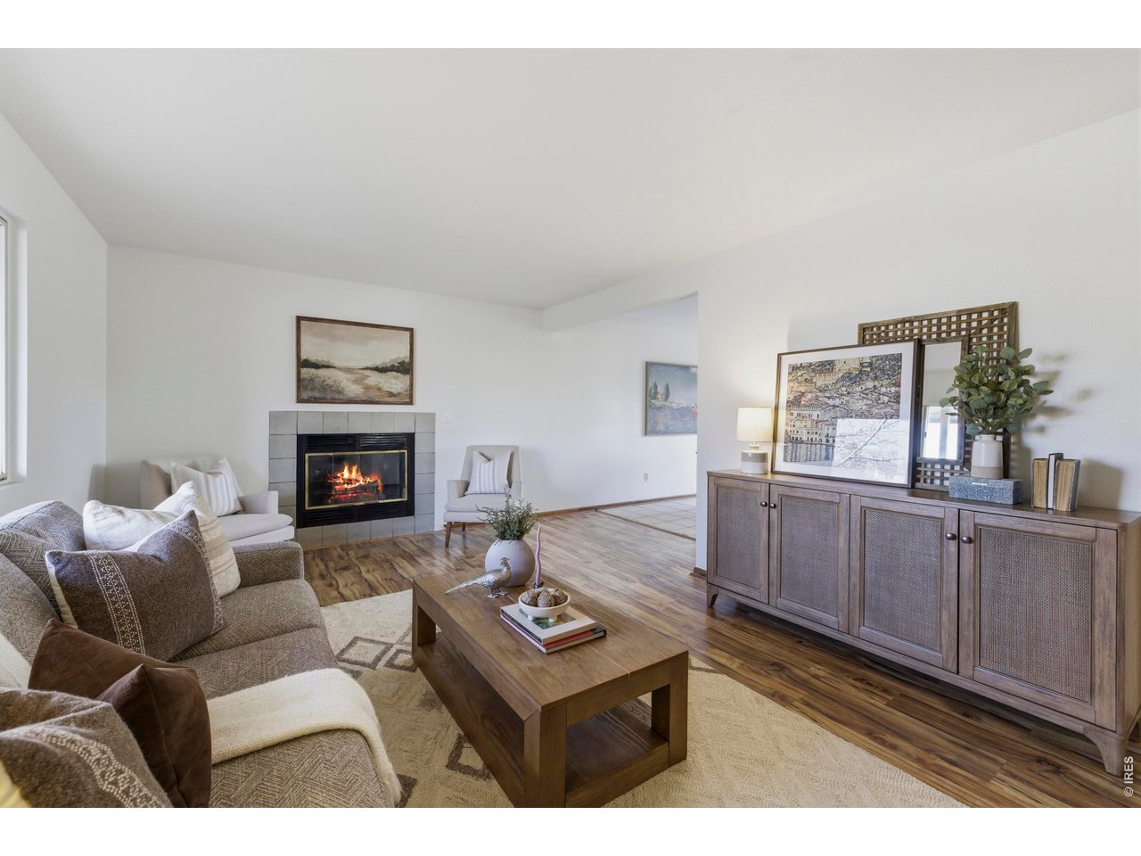 2943 Pleasant Valley Road Fort Collins, CO 80521 - Photo 5 of 38 a living room with furniture a flat screen tv and a fireplace