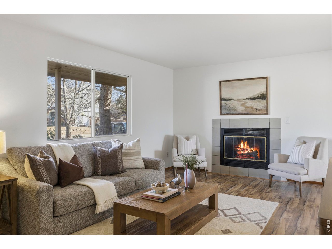 2943 Pleasant Valley Road Fort Collins, CO 80521 - Photo 8 of 38 a living room with furniture a fireplace and a large window