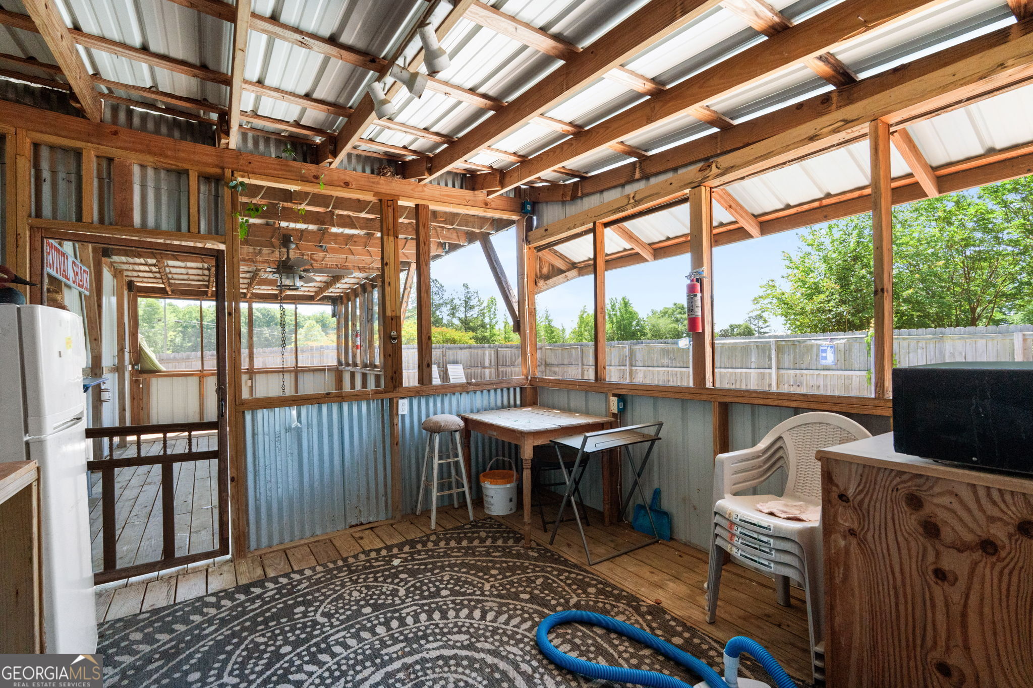 49 Frost Road Bowdon, GA 30108 - Photo 53 of 60 a view of a porch with furniture and a yard