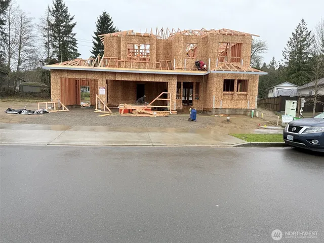 a view of a car park in front of house
