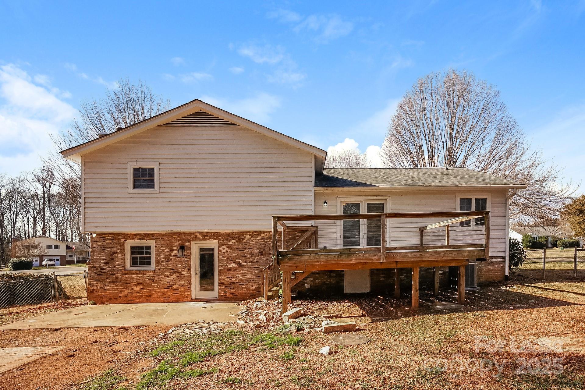 167 Mooreland Road Mooresville, NC 28117 - Photo 14 of 18 a view of a house with a yard covered in snow