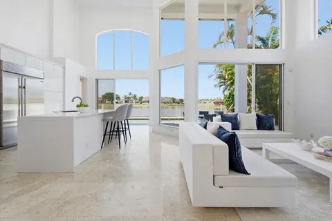 a kitchen with a sink and large window