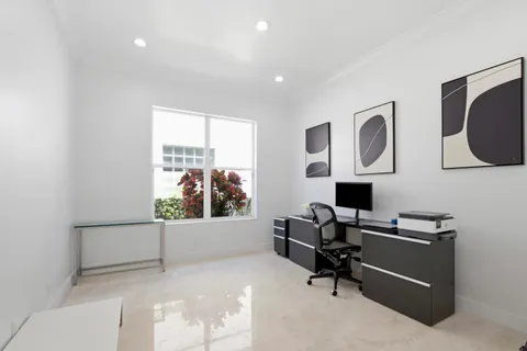 a bathroom with a double vanity sink mirror and bathtub