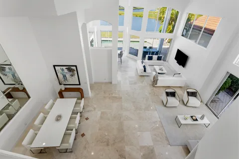 an aerial view of residential houses with outdoor space