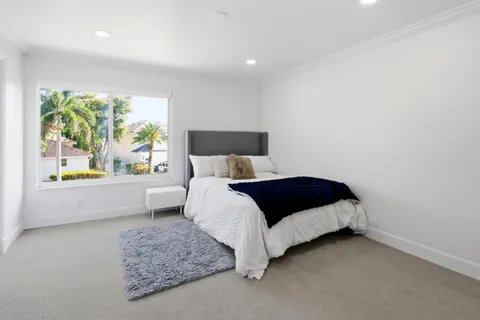 a view of a swimming pool and a lounge chair