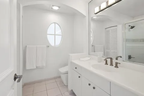 an aerial view of a house with a lake view